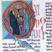 Historiated initial showing the Eucharist, with a grotesque, from Decretum cum glossa ordinaria Johannis Teutonici
